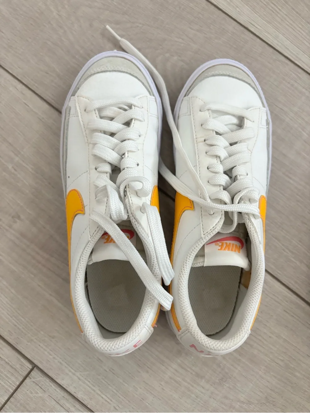 Nike White Sneakers with Yellow Swoosh